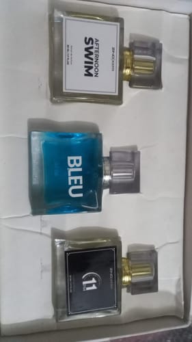 Customer's Summer Box set featuring Afternoon Swim, Bleu, and 11 PM perfume bottles inside the white packaging.