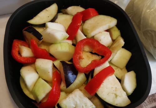 Customer's Novio StonePro Air Fryer basket filled with chopped raw vegetables