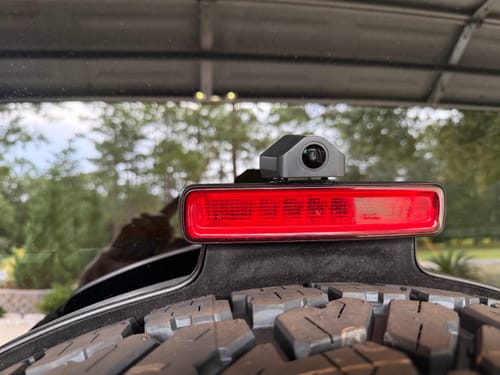 Customer's WOLFBOX G900TriPro camera mounted above the red taillight on a tire.
