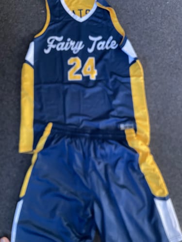 Customer's navy and gold sports uniform set, including a jersey labeled Fairy Tale 24 and matching athletic shorts.