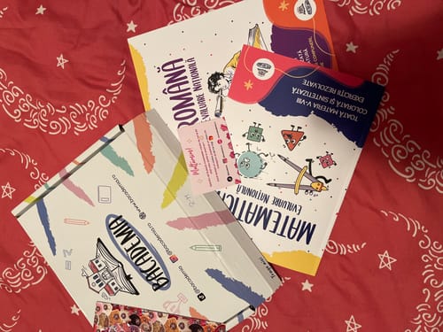 Customer's Pachet Evaluare Națională, including colorful workbooks for Romanian and Math, on a star-patterned background.