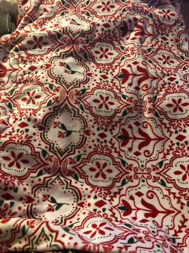 Customer's Christmas pillowcase, showing a red and green geometric pattern on a soft fabric.