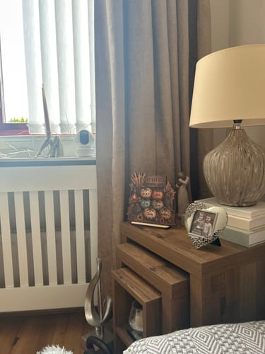 Customer's Western Leopard Grandma's Pumpkin Patch wooden plaque displayed on a wooden end table next to a lamp.