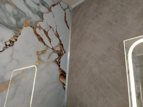 Customer photo review of Panneau Mural PVC Marbre Qatar – Veiné doré, Facile a Poser