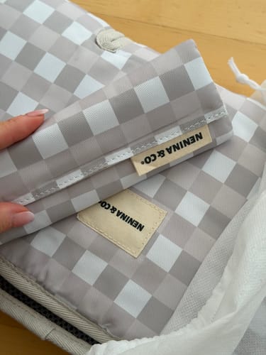 Customer's Colchoneta Universal Silla de Paseo, showing the grey and white Vichy patterned fabric and brand tag.