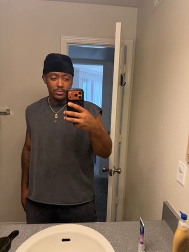 Reviewer's Elevated Essentials Cut Offs in dark grey, shown in a mirror selfie.