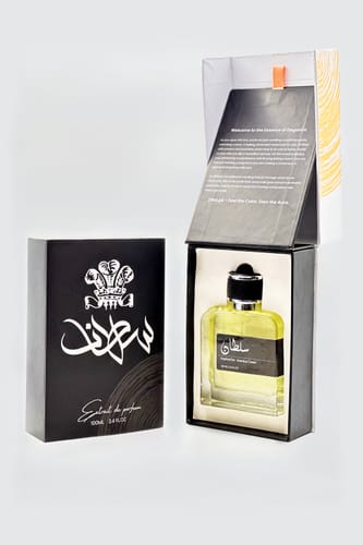 Customer's Sultan perfume bottle placed in its elegant, open black box with white branding.