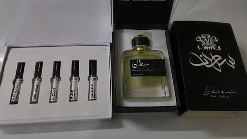 Customer's Make Your Own Tester Pack showing five small perfume bottles next to a large perfume bottle and black box.