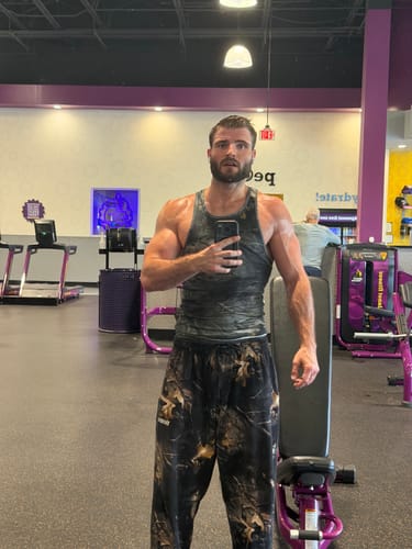 Customer's Date Night Knit Tee worn as a tank top in a gym setting, showing a fitted cut.