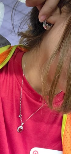 Customer's silver Luna Hoop Earring worn on the ear, showing its detailed shape.