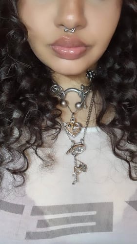 Customer's SUNNY & LUNA REAL SEPTUM worn in septum piercing, featuring metallic design
