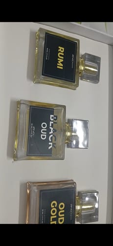 Customer's Royal Oud Collection set featuring three square glass perfume bottles labeled Rumi, Black Oud, and Oud Gold.
