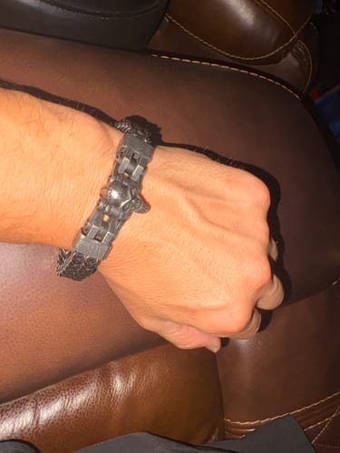 Customer's Vindicta Punisher Dark Edition Bracelet worn on a wrist, featuring a dark metal skull design.