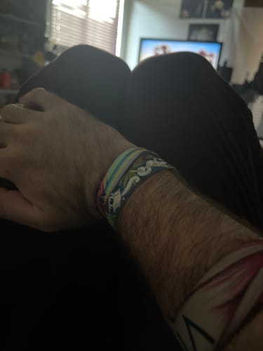 Reviewer's arm wearing two colorful, patterned ZOX wristbands from the Mystery 3-Pack collection.
