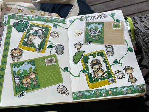Reviewer's Ultimate Subscription journal pages filled with green jungle-themed stickers and decorative elements.