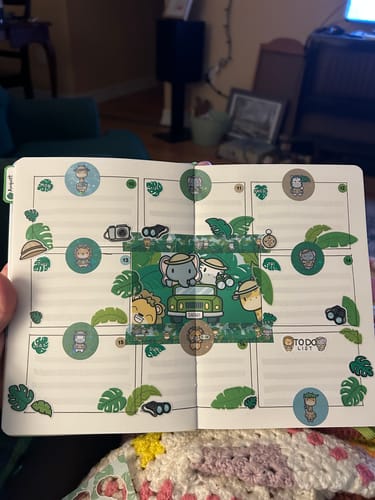 Reviewer's Ultimate Subscription planner spread with jungle-themed stickers and a central car illustration.