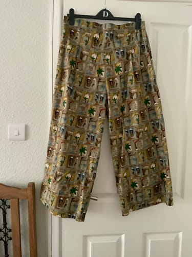Customer's Seaside Stroll Pima Cotton Lawn Fabric made into wide-leg trousers, hanging on a door.