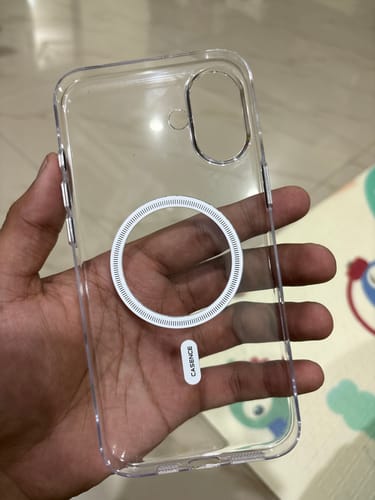 Customer's hand holding a clear, MagSafe-compatible iPhone 16 Plus case.