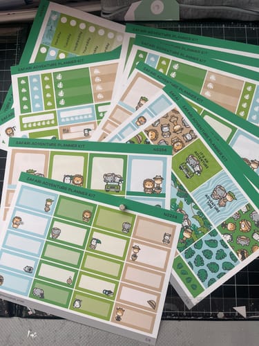 Reviewer's Ultimate Subscription safari-themed sticker sheets with task boxes and decorative planner elements.