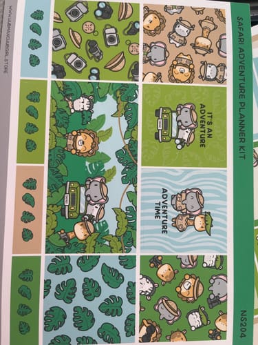 Customer's Ultimate Subscription safari planner kit sheet showing cute animal illustrations and tropical leaves.