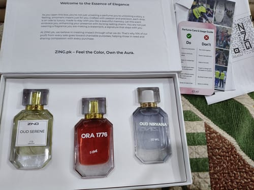 Customer's OUD Supreme Bundle gift set featuring three perfume bottles inside an elegant white box with a guide.