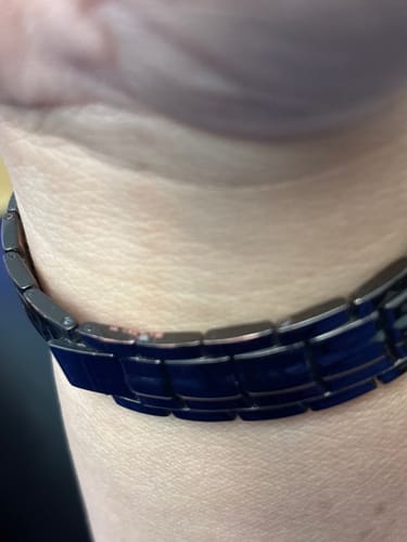 Customer's Power of the Lord’s Prayer Magnetic Copper Bracelet shown on their wrist, focusing on the side link connection.