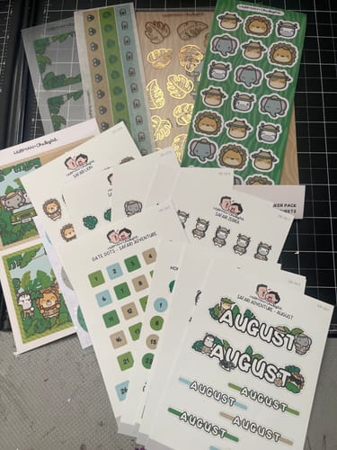 Reviewer's Ultimate Subscription sticker sheets featuring a zoo theme with animal characters and calendar dates.