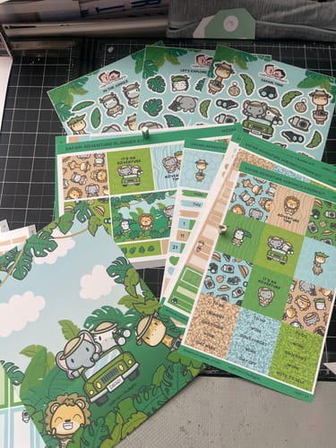 Reviewer's Ultimate Subscription sticker sheets for a safari theme, including planner layouts and safari animals.