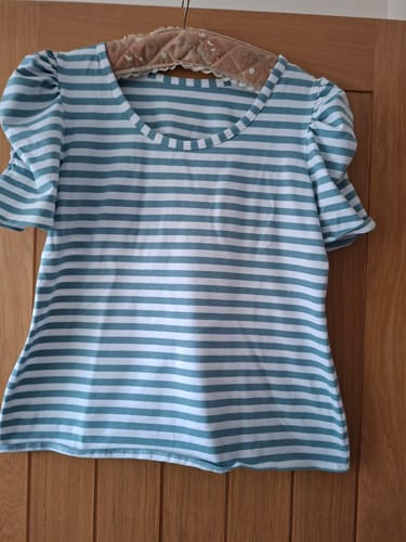 Customer's Tilly and the Buttons Agnes top made from Classic Striped Cotton Jersey Fabric hanging on a wooden door