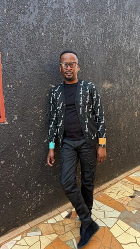 Customer's LFN018 Cardigen Knit Top in black, worn by a person leaning against a textured wall.