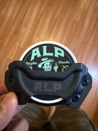 Customer's Tactical Holster holding a tin, showing the black sturdy construction.