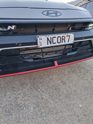 Customer's Hyundai i30N Sedan with the front number plate mounting kit installed on the black bumper