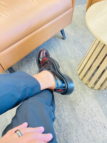 Customer's Lufiano Lace Up shoes in black and red worn on feet, viewed from above while sitting.