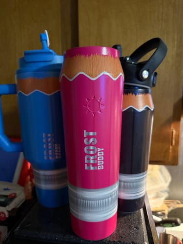 Customer's pencil-themed Thicc Buddy mug in pink standing next to other blue and black pencil-themed mugs.