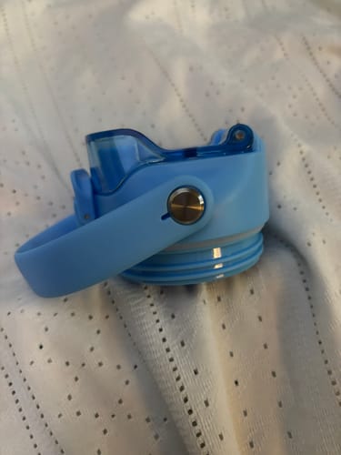 Customer's light blue Bottle Buddy replacement lid, showing the handle and flip-top spout.