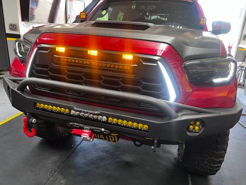 Customer photo review of 2016-2023 Tacoma Apex Pro Style Grille with LED Light Bar & Raptor Lights by YotaTribe