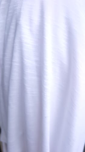 Customer's white Variegated Jersey Fabric, showing its lightweight texture and soft drape.