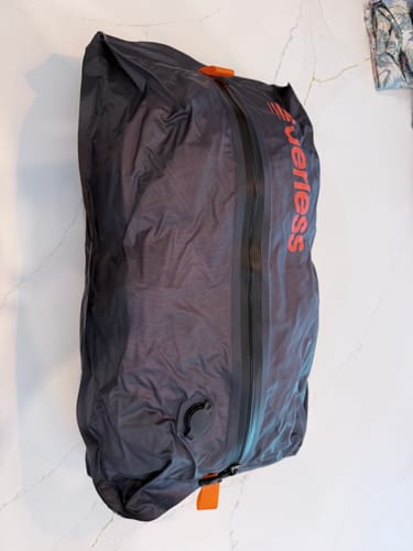 Customer's Aerless™ Vacuum Kit bag, empty and flat on a white surface.