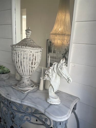 Customer's Apollon French Provincial Horse Head Bust sitting on a white console table next to a large decorative urn.