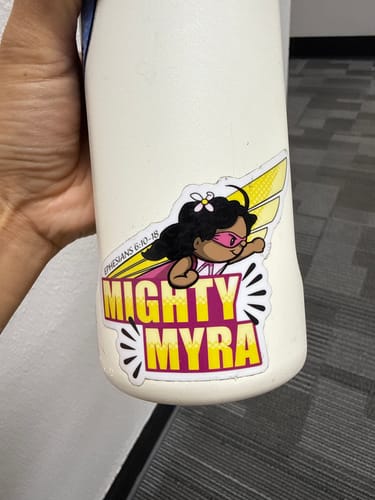 Customer's Mighty Myra custom vinyl sticker applied to a white water bottle held in hand.