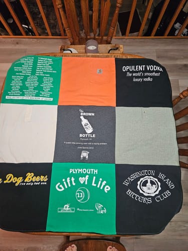 Customer's Project Repat T-Shirt Quilt featuring various colorful vintage shirts stitched into a patchwork layout.