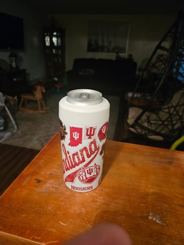 Customer's Indiana Hoosiers Universal Buddy can cooler sitting on a wooden surface.