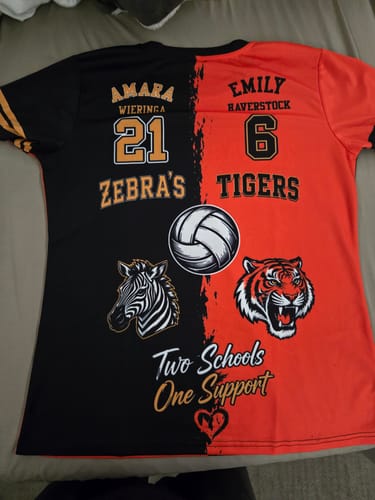 Customer's custom split-design sports shirt featuring volleyball, tiger, and zebra graphics with names and numbers.