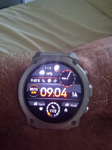 Reviewer's silver Gard Pro Ultra 3 watch on their wrist showing a bright digital clock interface.