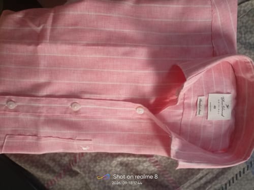 Customer's Tango Orange linen-blend shirt featuring white stripes, a spread collar, and button front details.