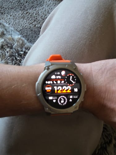 Customer's Gard Pro Ultra 3 watch with an orange strap, displayed on a person's wrist with a digital screen active.