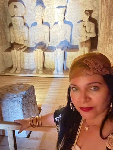 Reviewer's Hidrocor Quartz Blue Gray contact lenses on eyes, wearing a headscarf in an Egyptian temple.