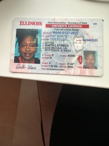 Reviewer's Illinois driver's license shown to verify identity for the Heal My People Tour registration.