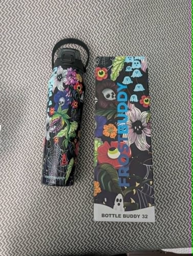 Customer's Bottle Buddy in Toxic Bloom print next to its matching branded product box.