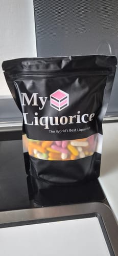 Customer's My Liquorice branded pouch containing colorful, sugar-coated liquorice Comfits.